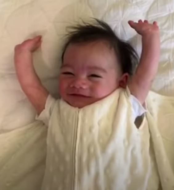 Little Baby Adorably Throws Arms Up After Being Unswaddled