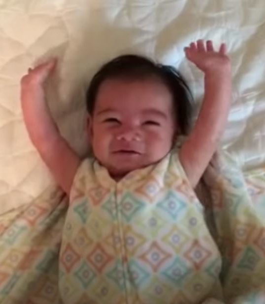 Little Baby Adorably Throws Arms Up After Being Unswaddled