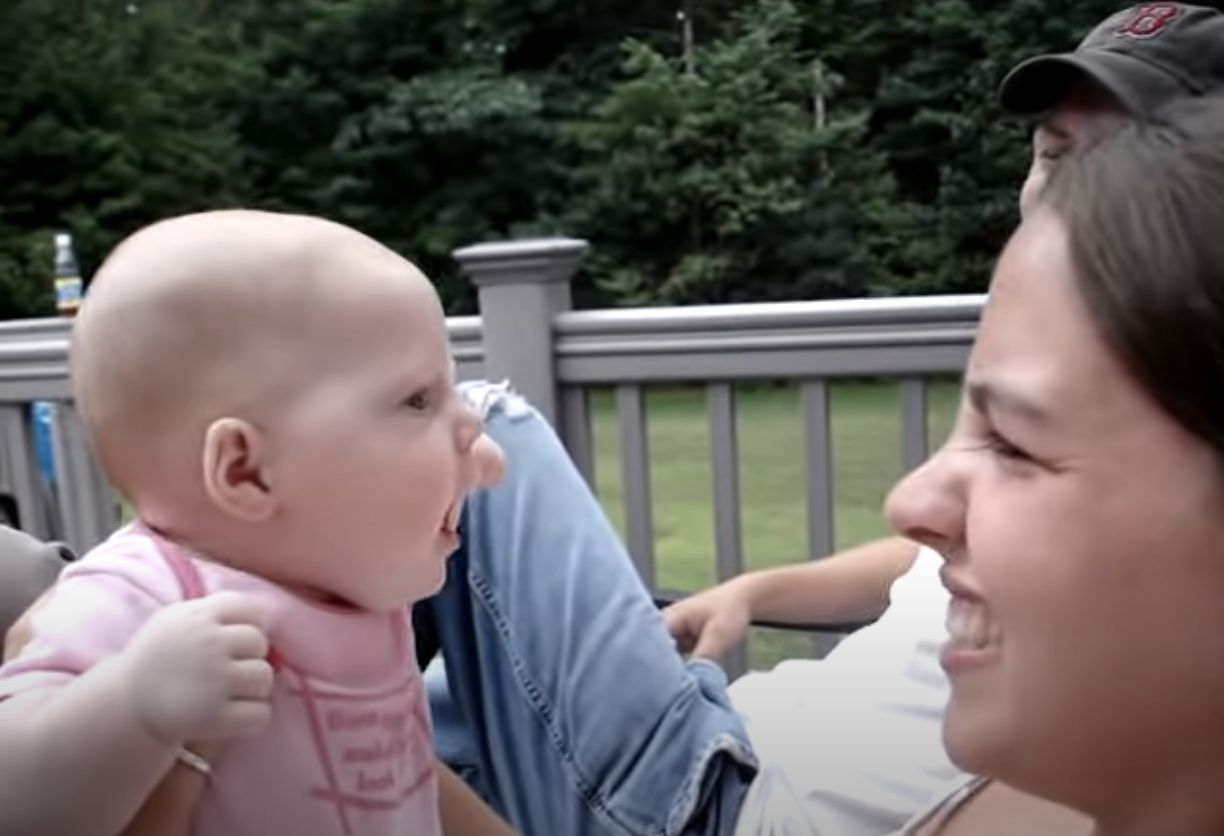 Aunt growls at baby girl making everyone laugh when baby quips back her